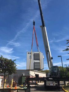 commercial generator installation with crane